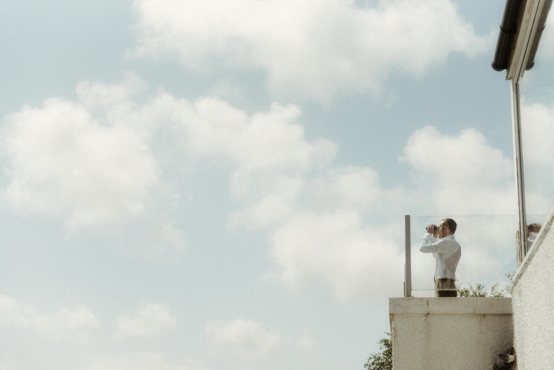 a man with binoculars looking for wedding rings to buy