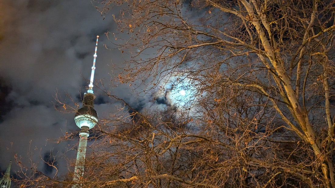 TV tower in berlin next to the moon at night in January 2025