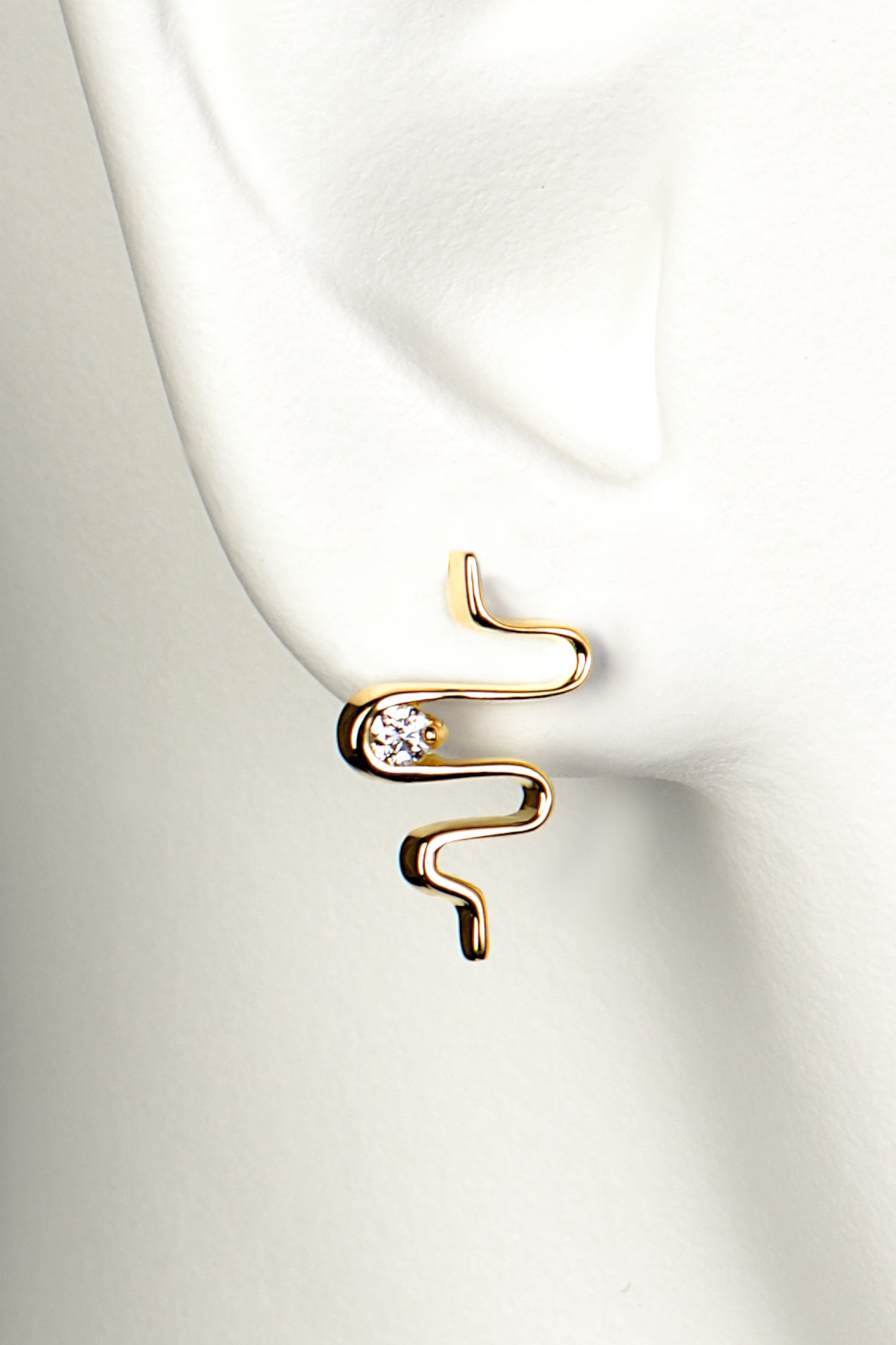 Romantic diamond 18 carat gold earrings in the shape of a heartbeat exclusively available from Christine Sadler