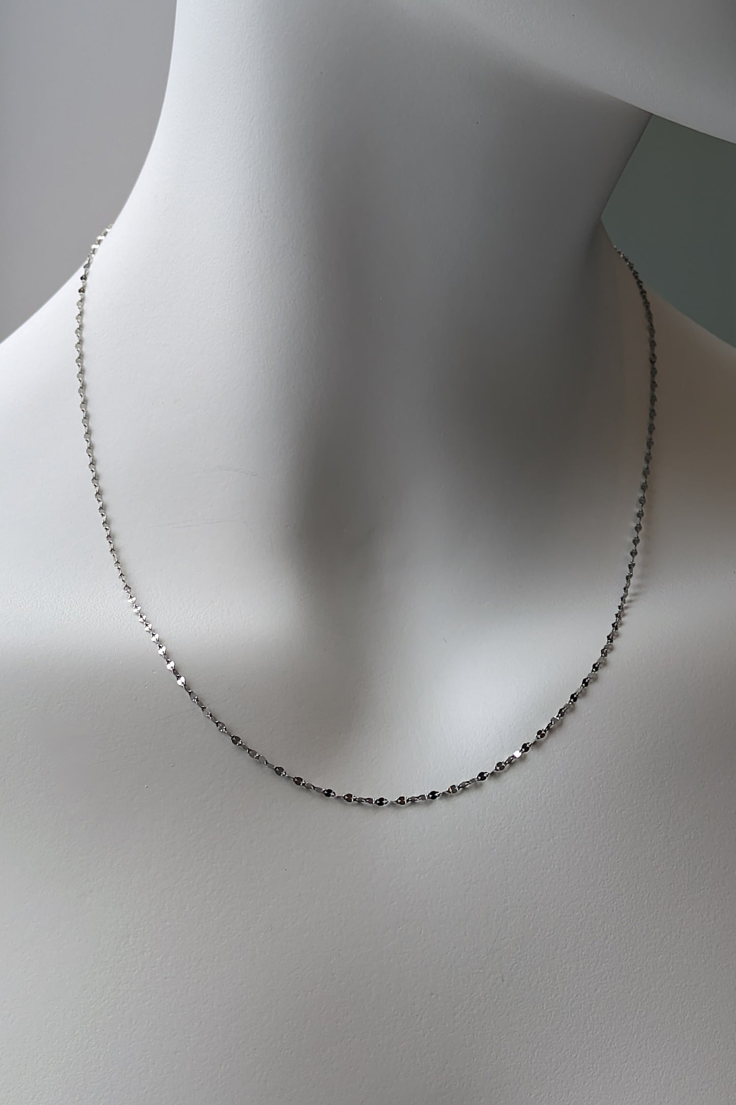 a delicate 18 inch platinum necklace chain that can be worn everyday and doesn't need a pendant shown in 18 inch