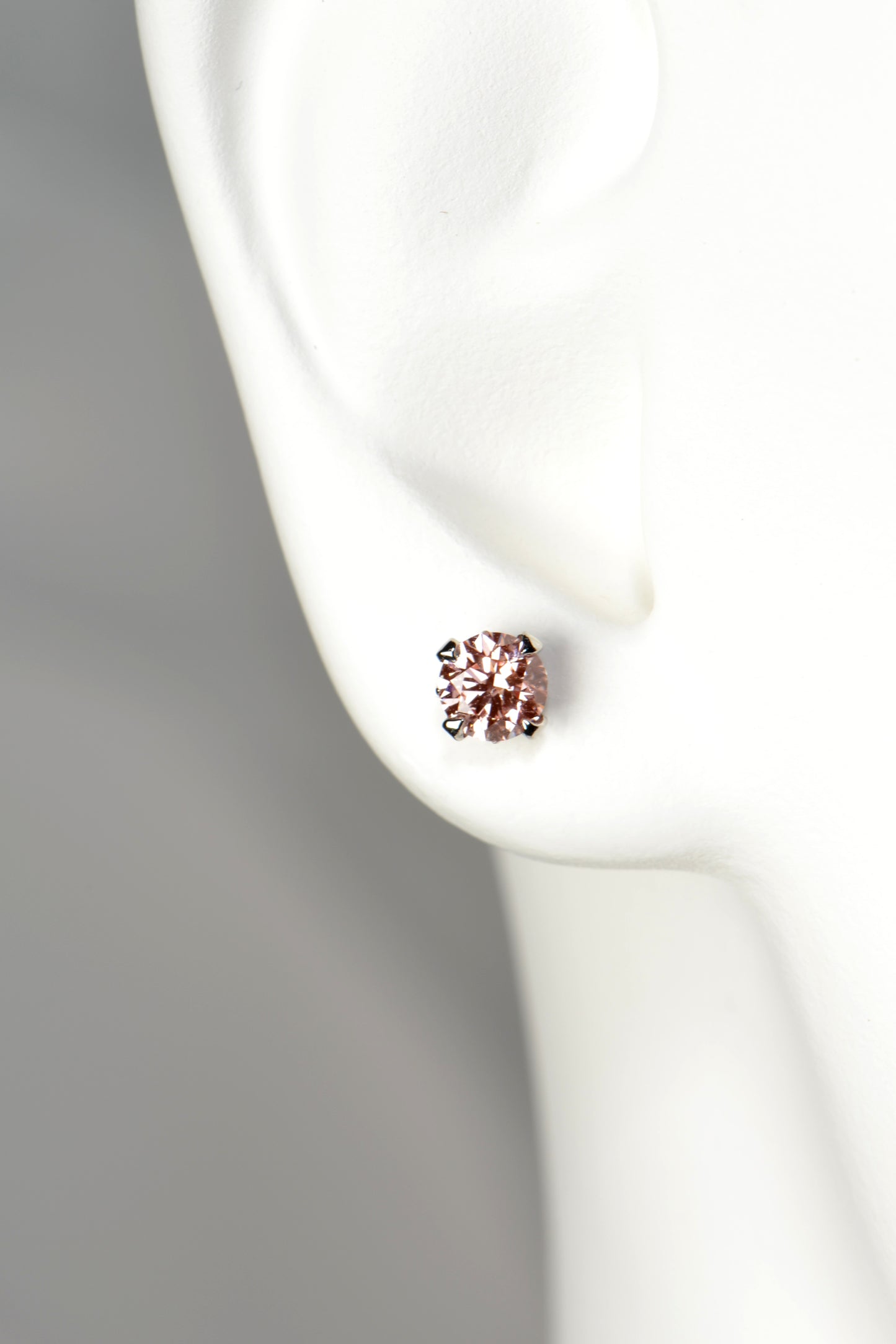 fancy vivid pink coloured lab diamond platinum earrings exclusively available from Christine Sadler