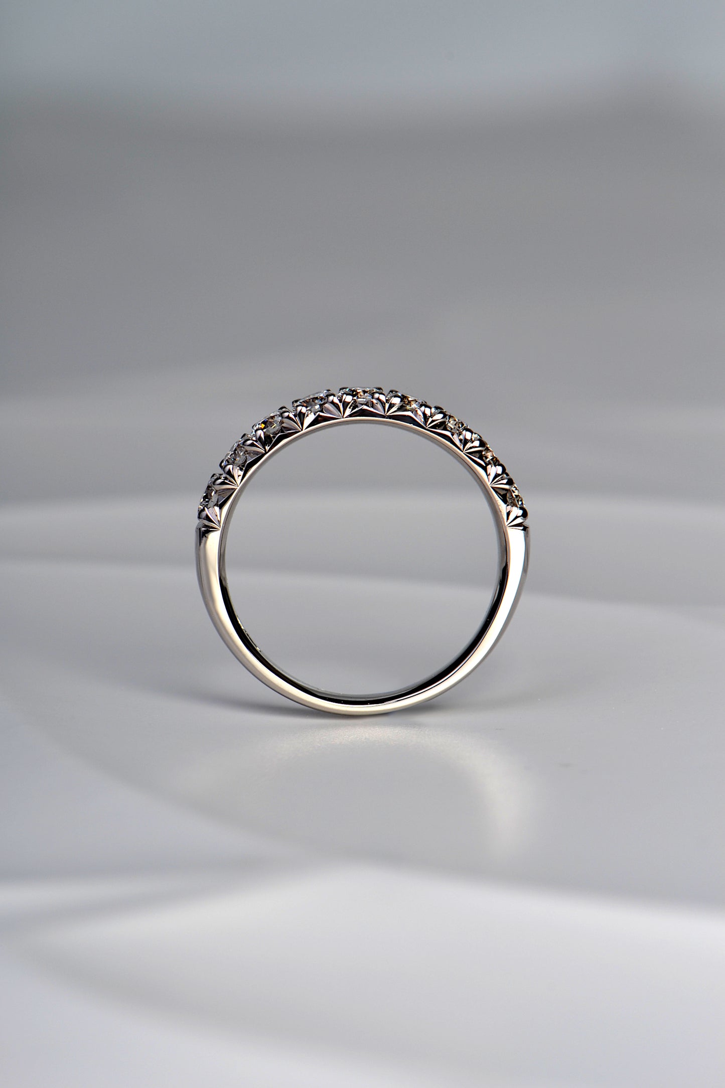 beautiful fishtail setting creates small heart shapes with the ring is viewed side on