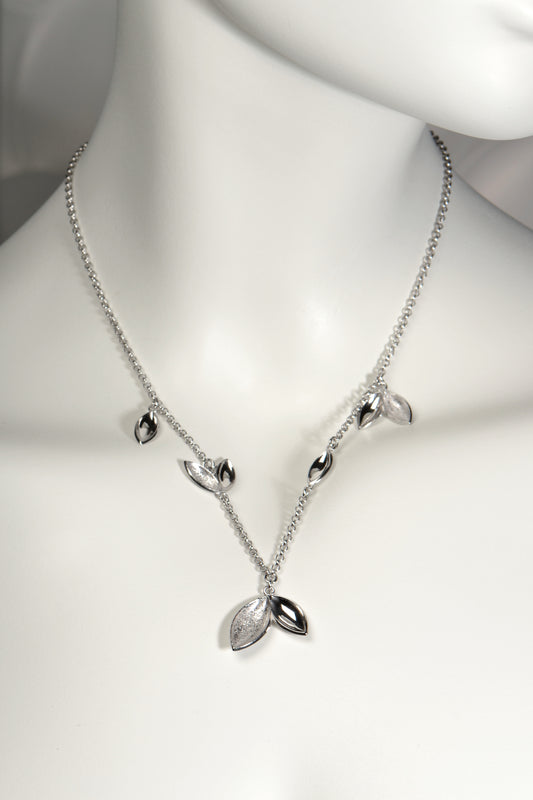 really special silver charm necklace from Christine Sadler with a modern sculptural design. Called The Promise, for each necklace sold, a tree is planted in Scotland