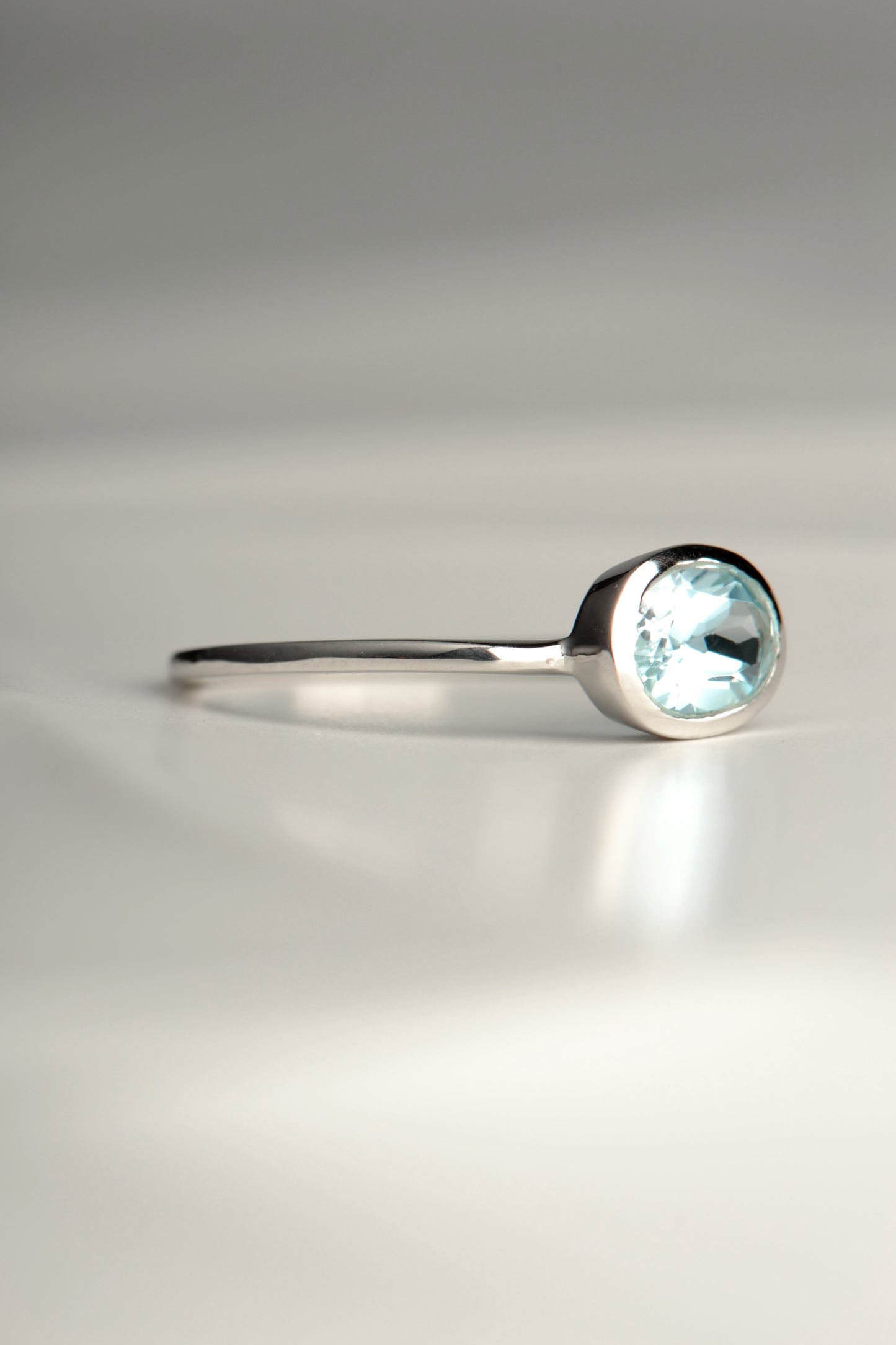 oval blue topaz delicate silver ring for a girl or woman