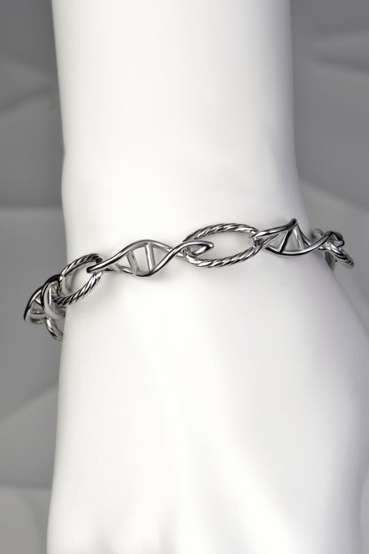 Chunky silver designer bracelet with a family dna design exclusively from Christine Sadler