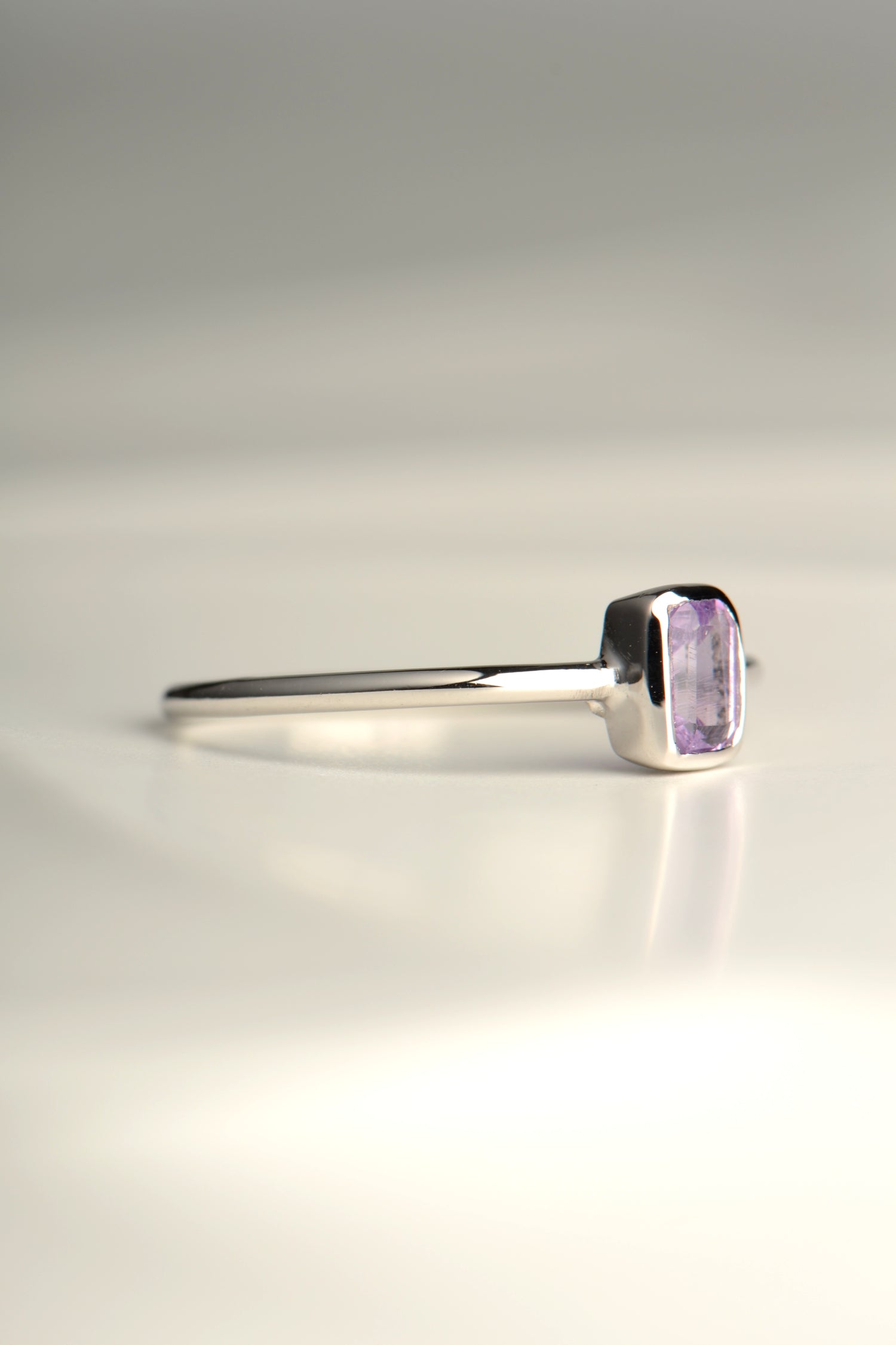 slim silver ring with a rectangular amethyst gemstone for a woman or girl from jewellery designer Jorge Revilla