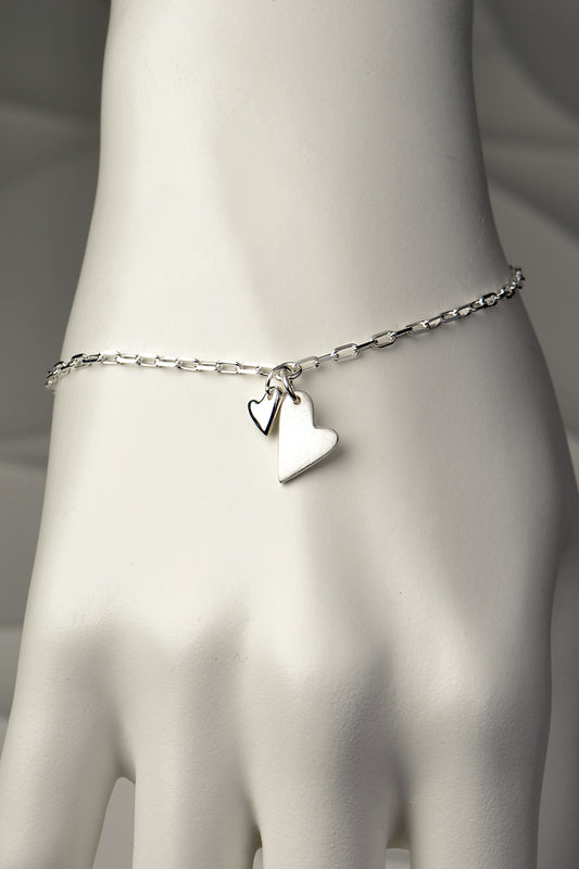 Modern real silver designer bracelet with two hearts hanging at the front - Christine Sadler