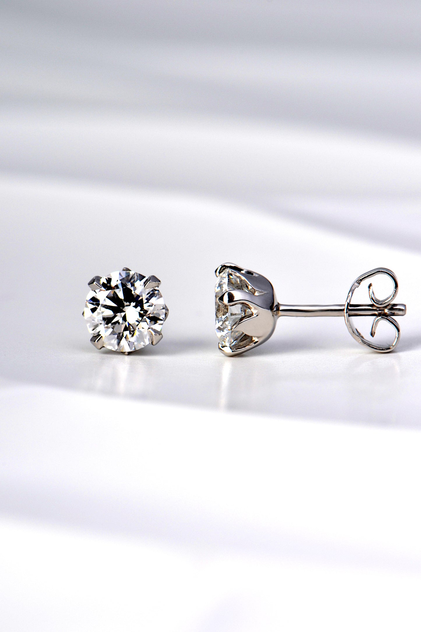 tiny platinum flame two carat lab diamond earrings exclusively available from Christine Sadler