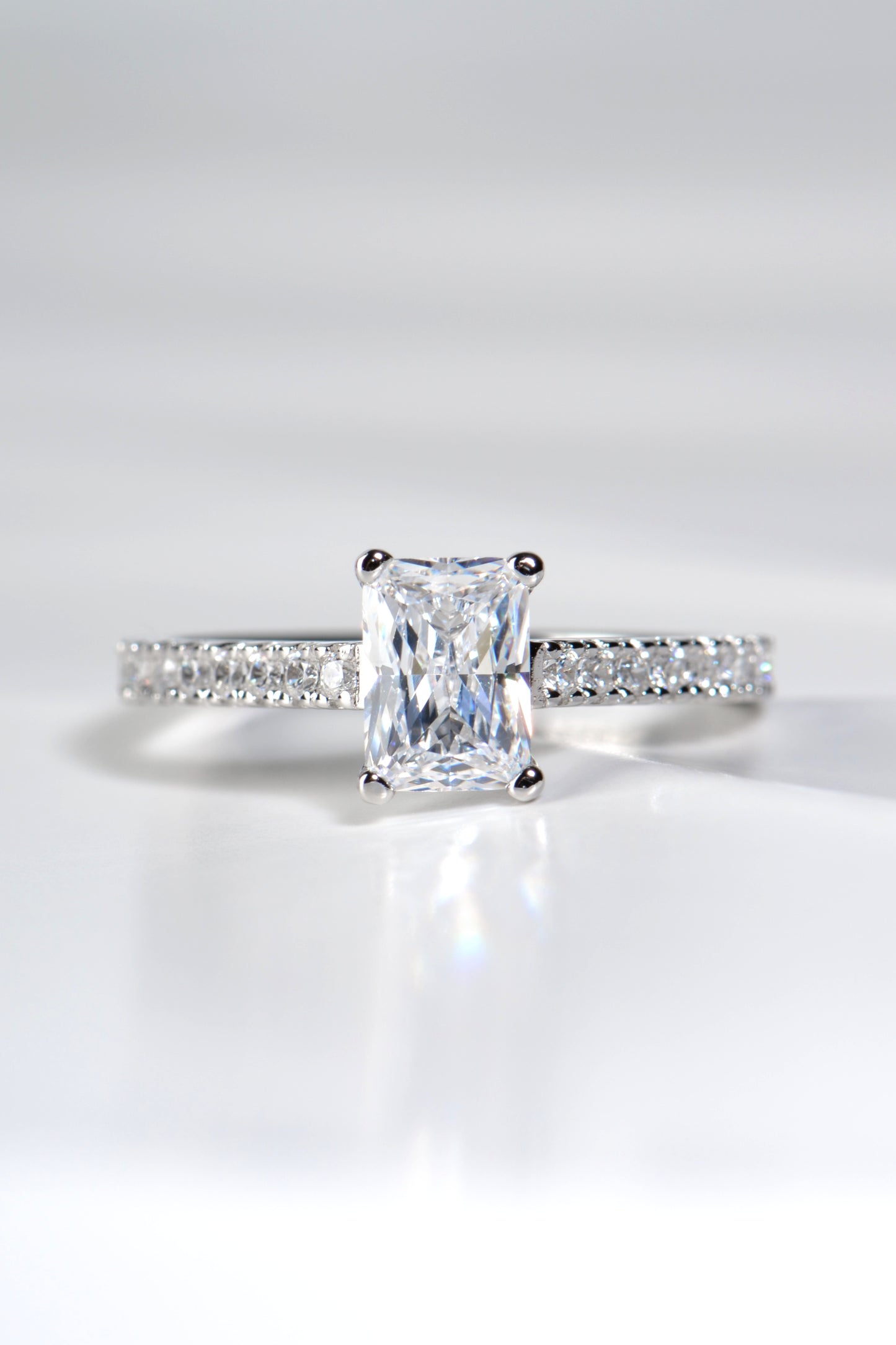 modern high quality British emerald cut diamond platinum engagement ring