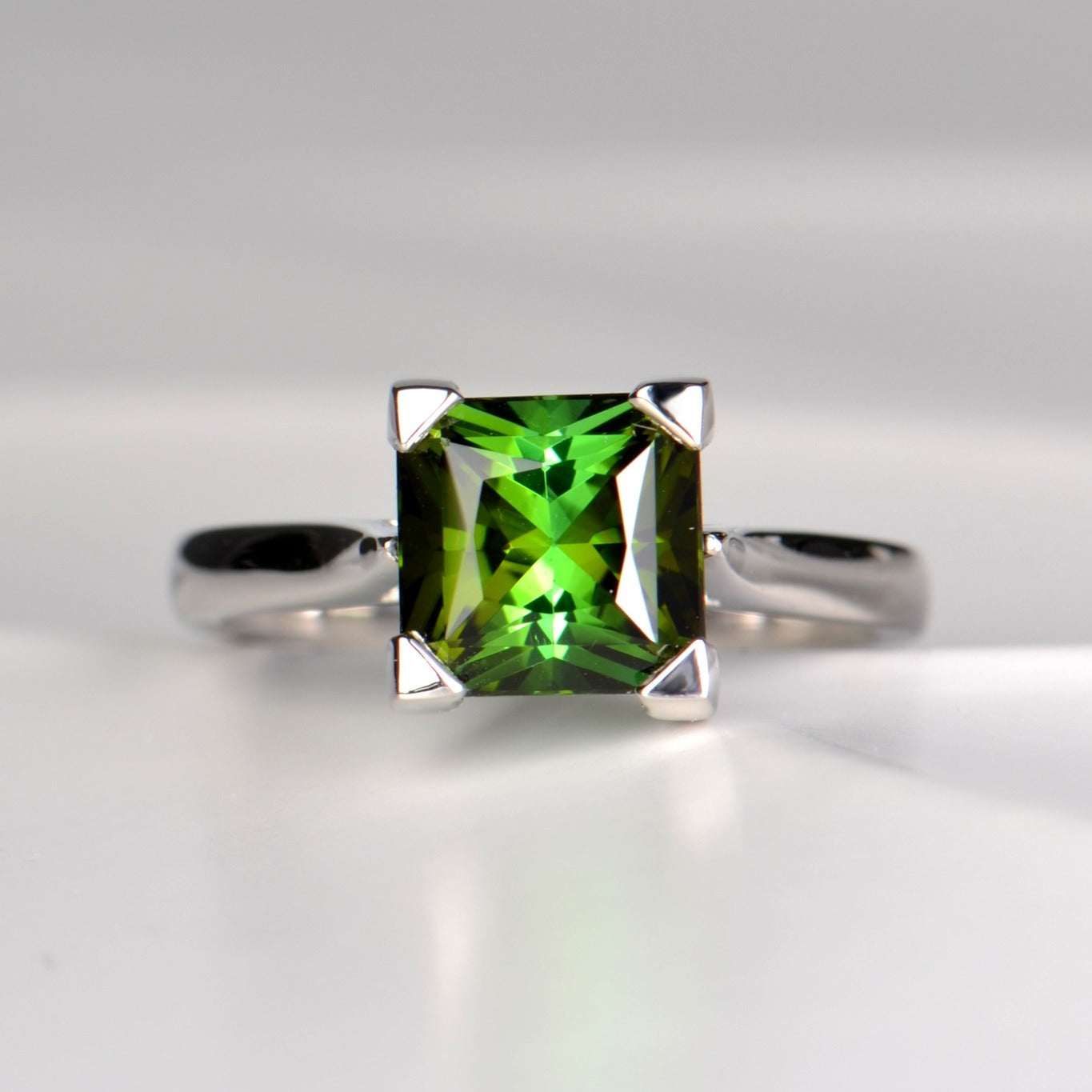 Square green tourmaline ring in aodern platinum ring design with no diamonds by Christine Sadler