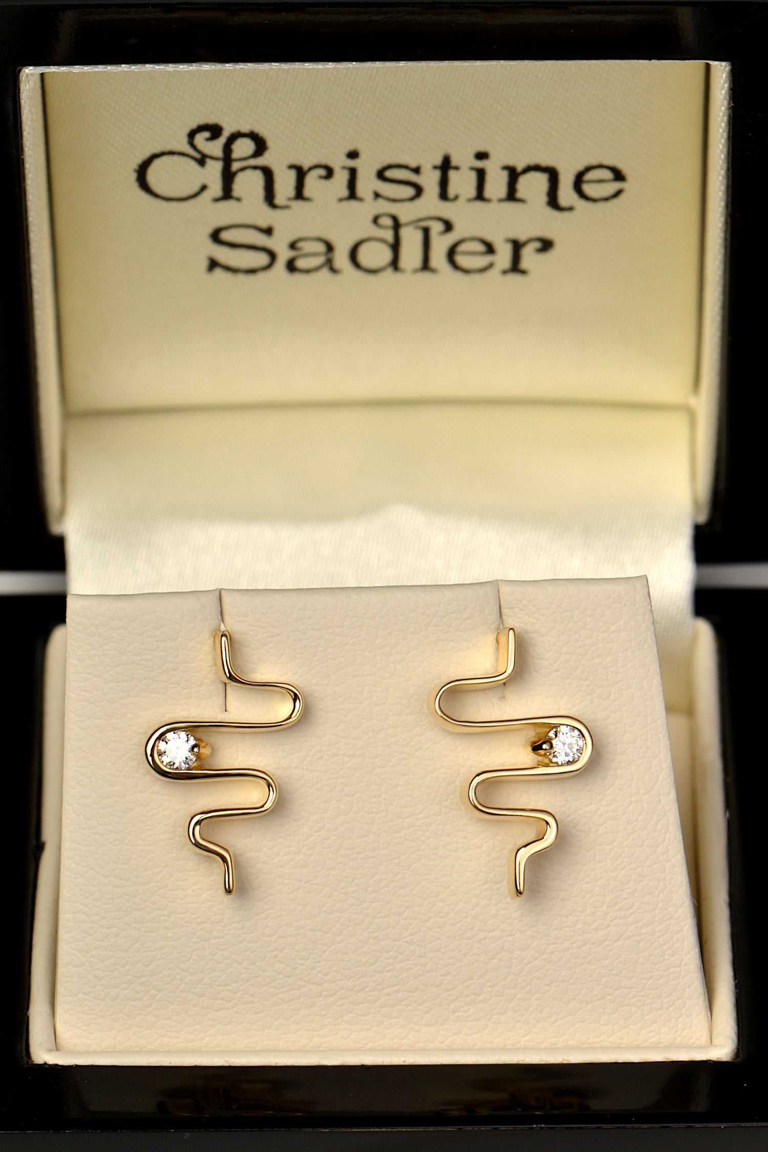 modern fine jewellery 18ct diamond earrings in the shape of a heartbeat from designer Christine Sadler