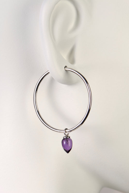 modern large silver real silver hoop earrings with real gemstones. This one has amethysts - jewellery designer is Jorge Revilla