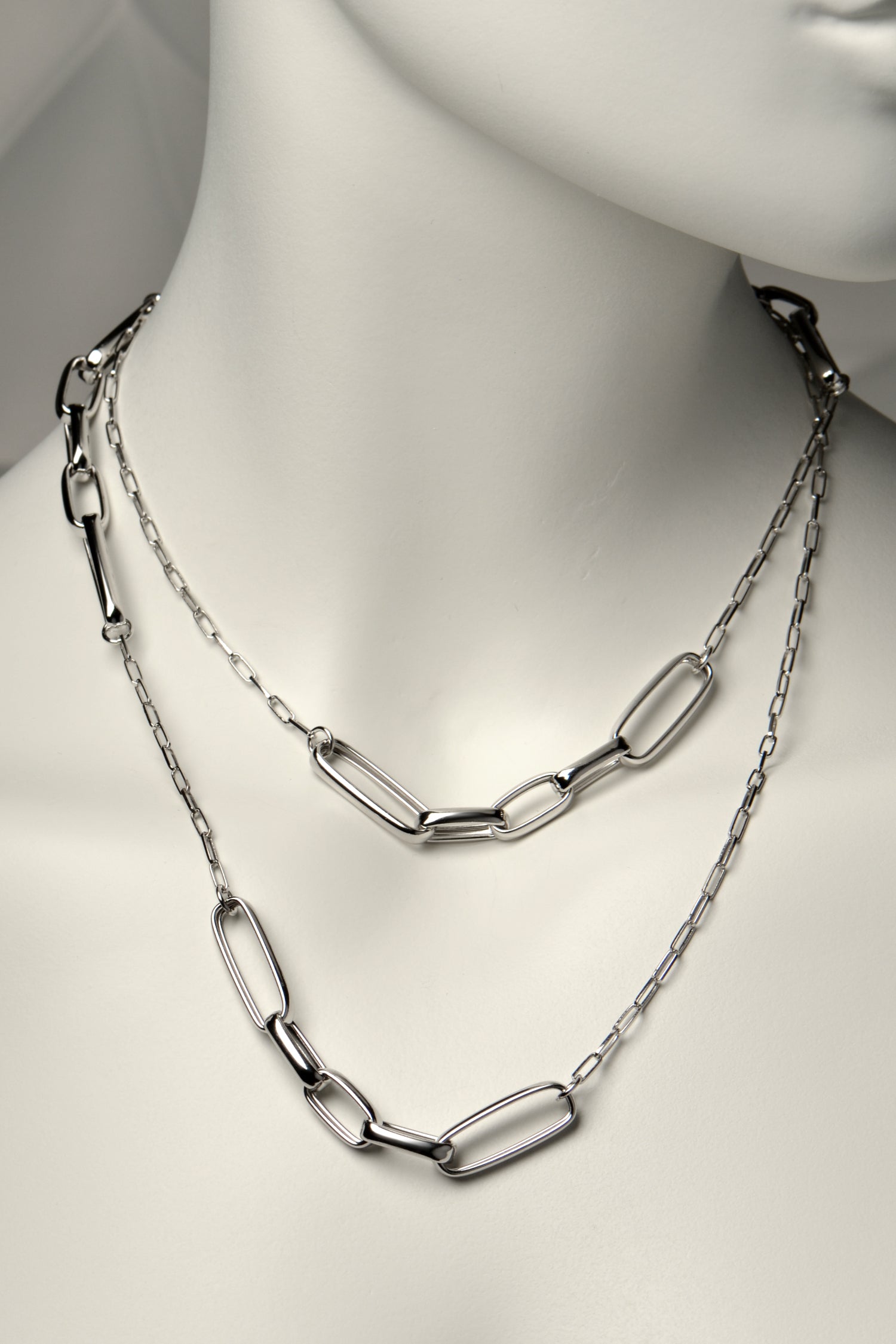 long paper link real silver necklace that can be doubled over and worn so it looks like two necklaces. Long and short links are mixed to give it a modern stylish look. From jeweller Christine Sadler