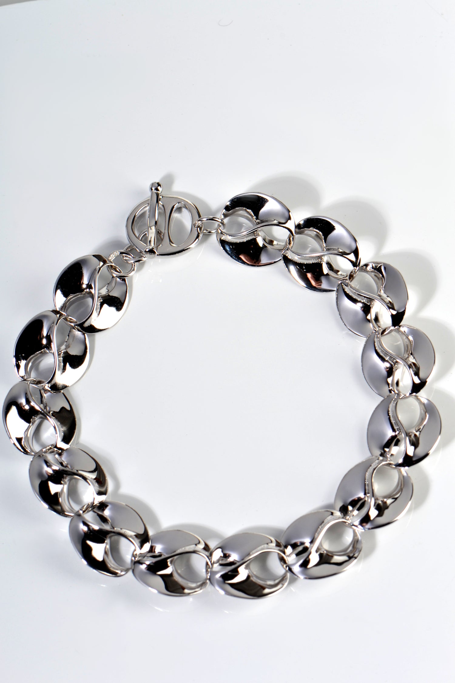 stunning designer sterling silver bracelet for women with an interlocking mobius link that symbolises eternal love. Hand crafted to the highest standard, this bracelet was handmade in Spain and designed by Jorge Revilla