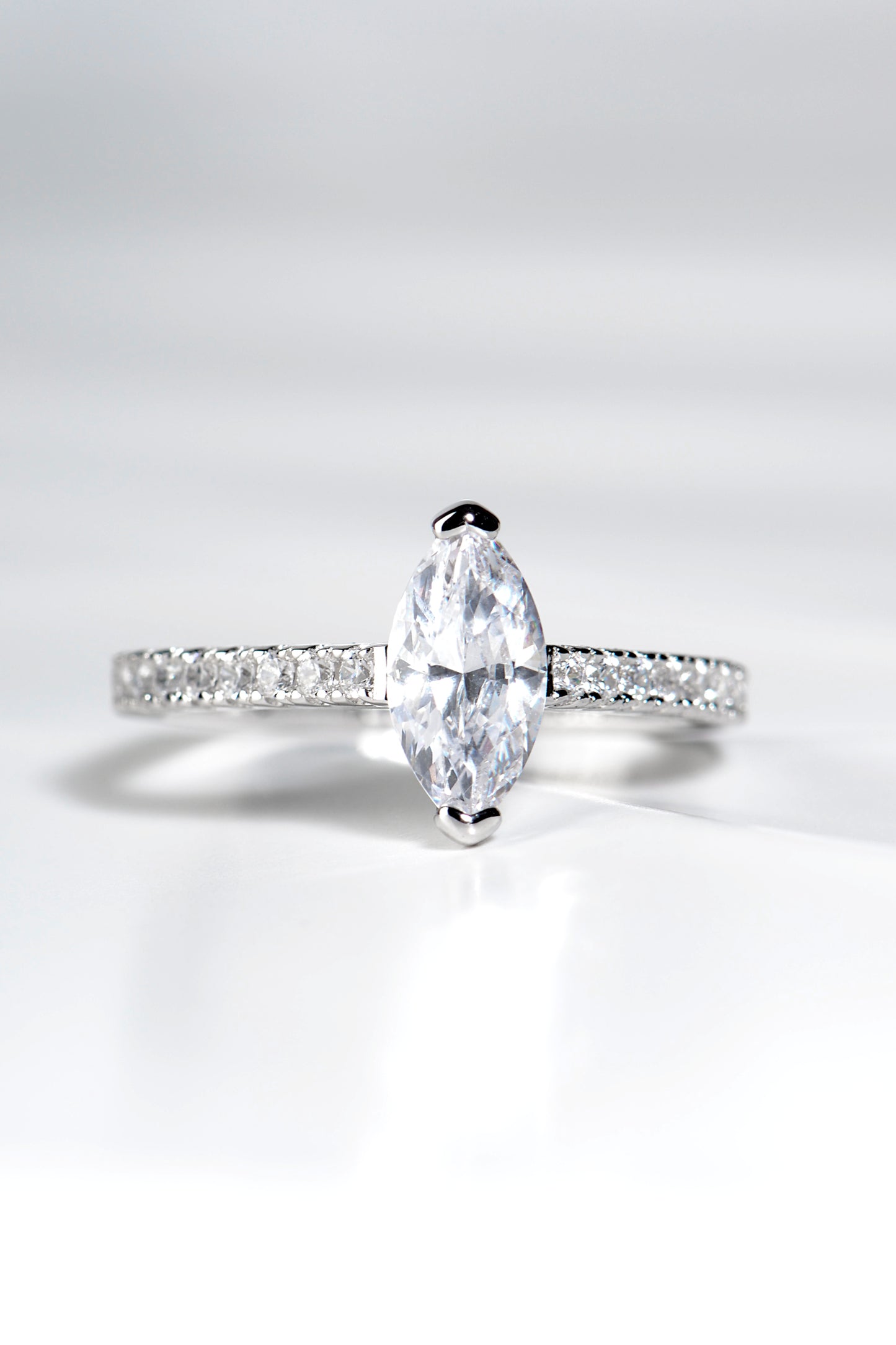 modern high quality platinum marquise cut diamond engagement ring with diamonds set in the shoulders, made in the UK