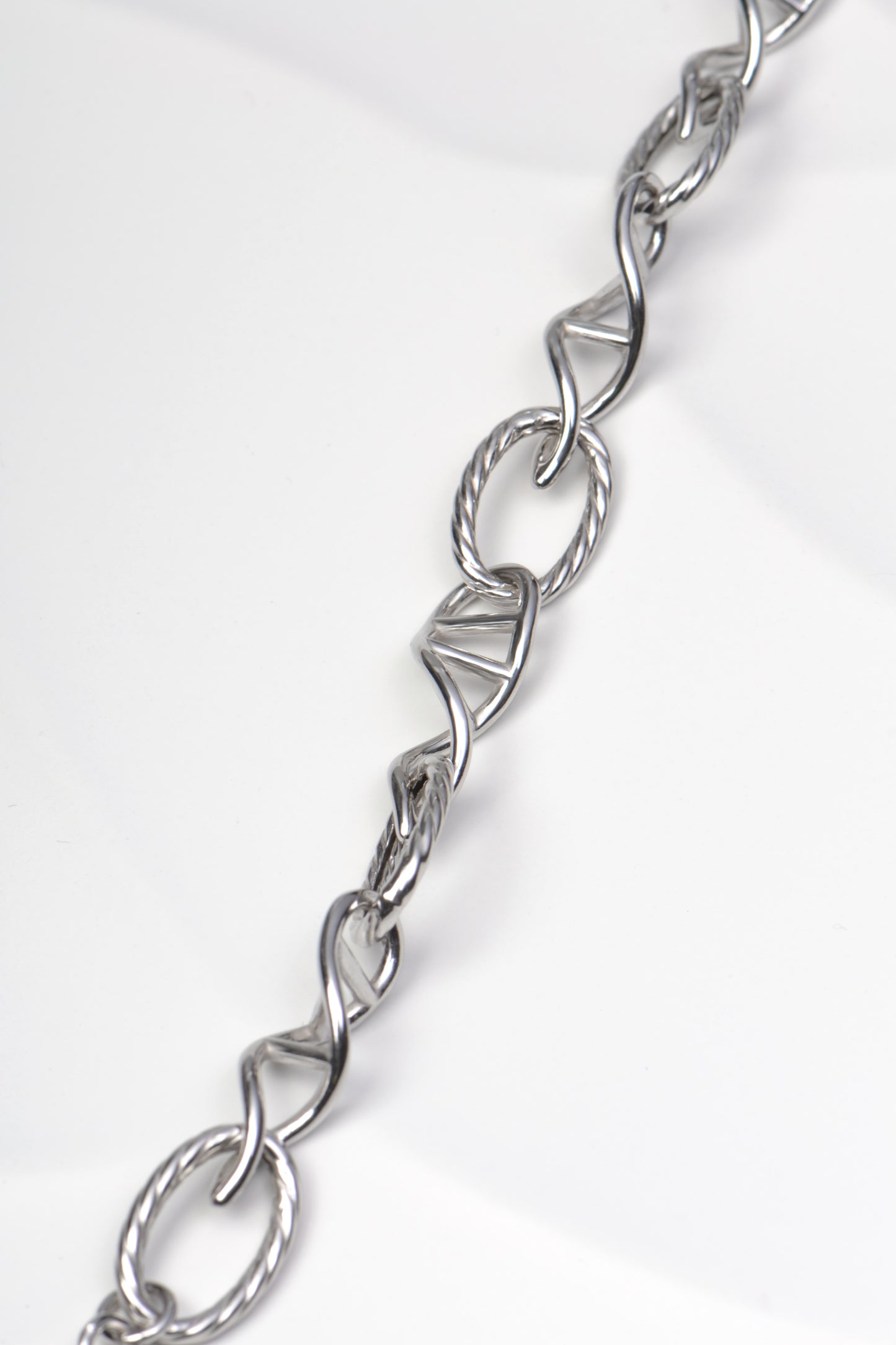 copyrighted silver designer bracelet with alternating DNA shaped links and a twisted rope link exclusively from Christine Sadler