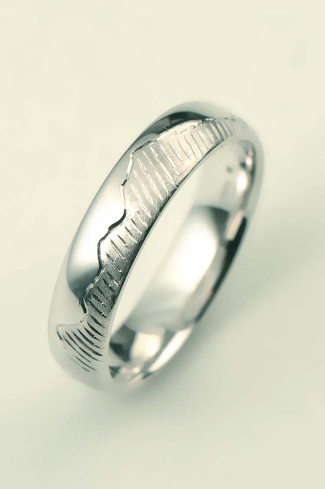 handmade wedding ring with mountain design engraved on the outside from jewellery designer Christine Sadler