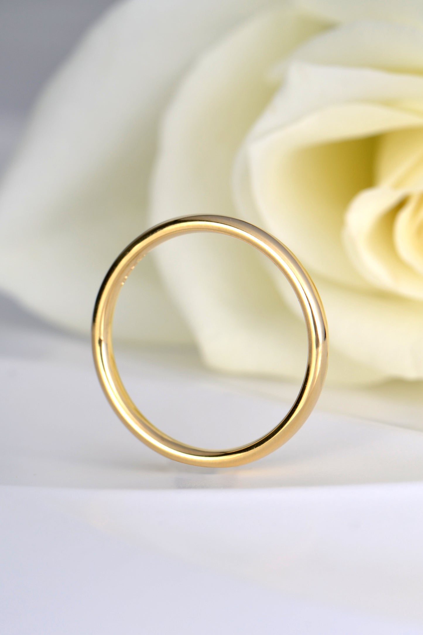 narrow gold wedding ring without stones for a woman - british