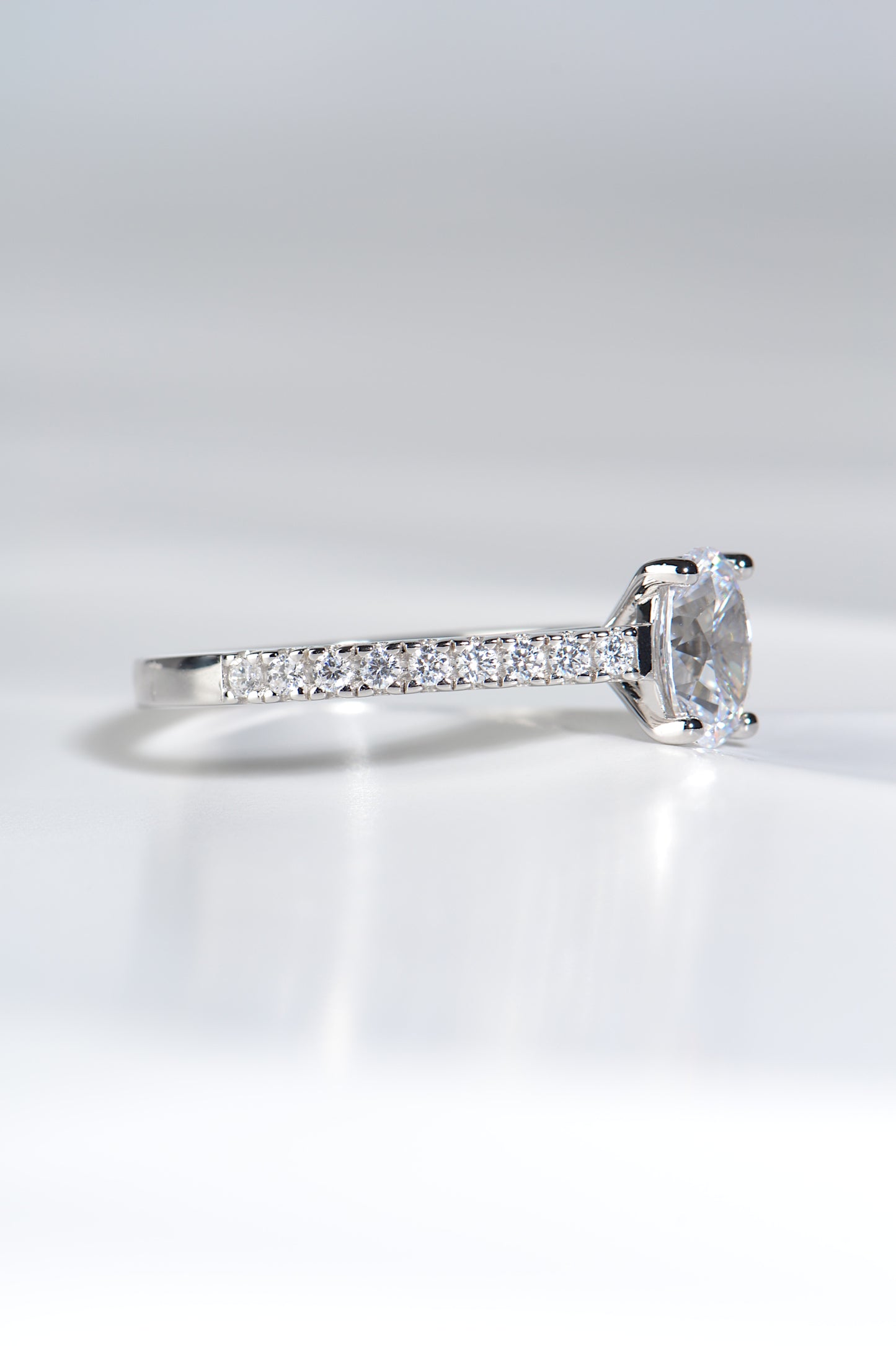 platinum oval cut diamond ring with diamonds in the band, made in the UK