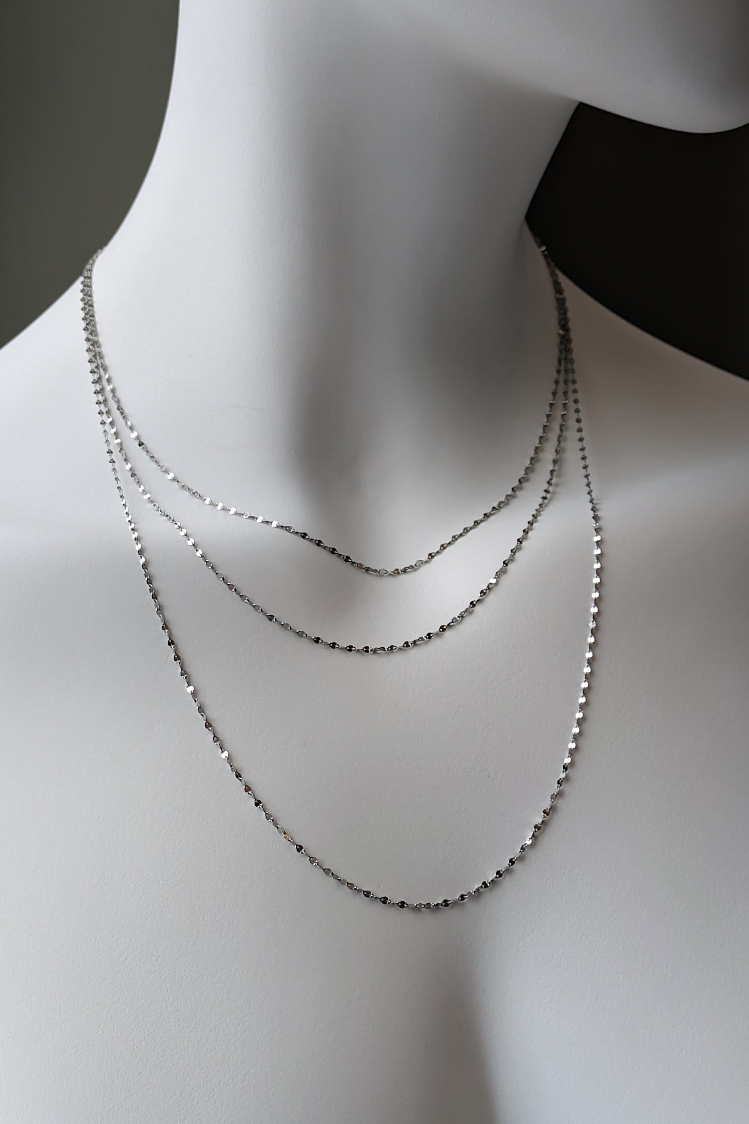 three delicate platinum chains that can be ordered in any length shown in 16 inch 18 inch and 22 inch