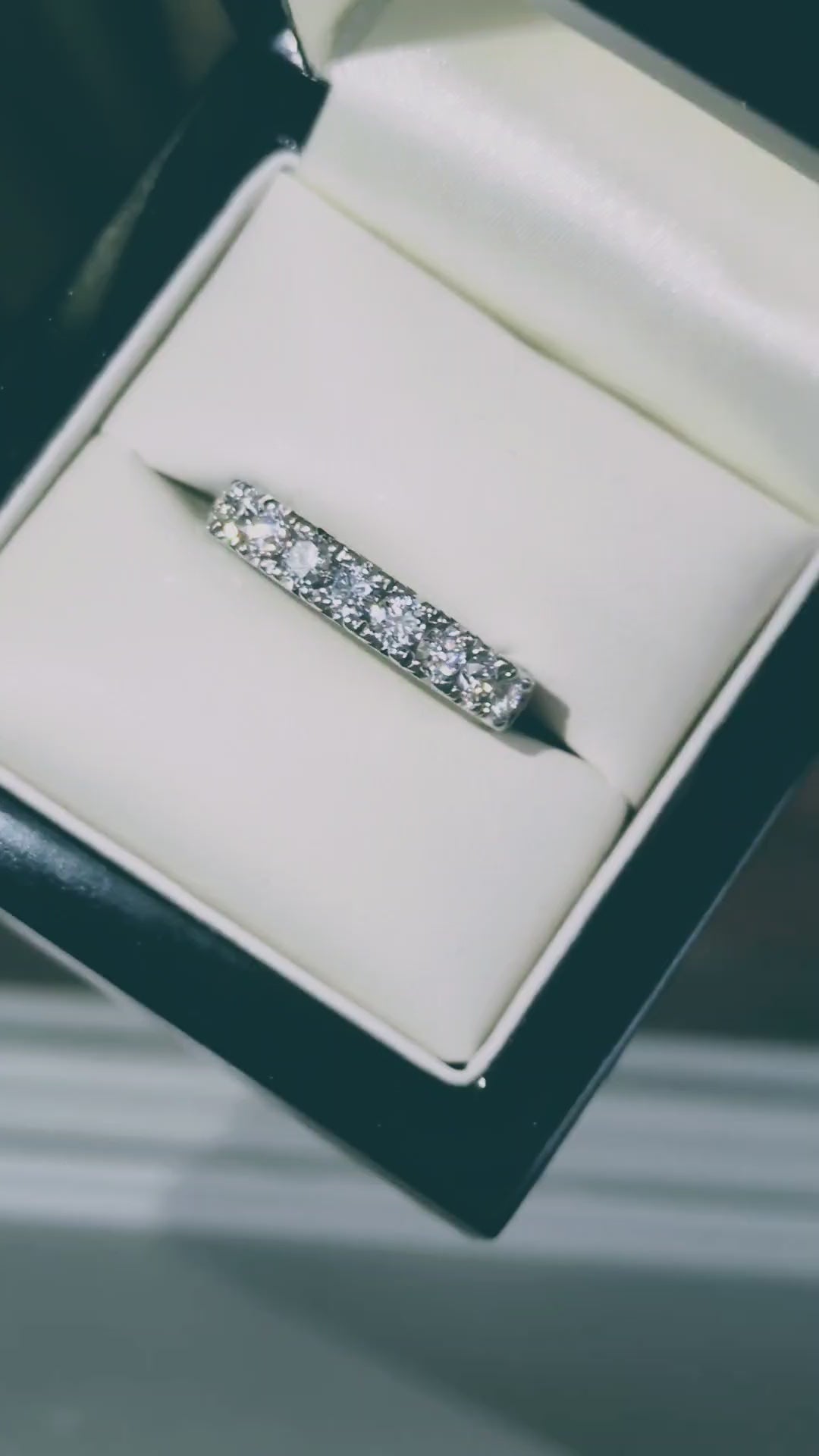 stunning platinum eternity ring set with nine round briliant cut diamonds that have incredible sparkle and have a total diamond carat weight of one carat. 