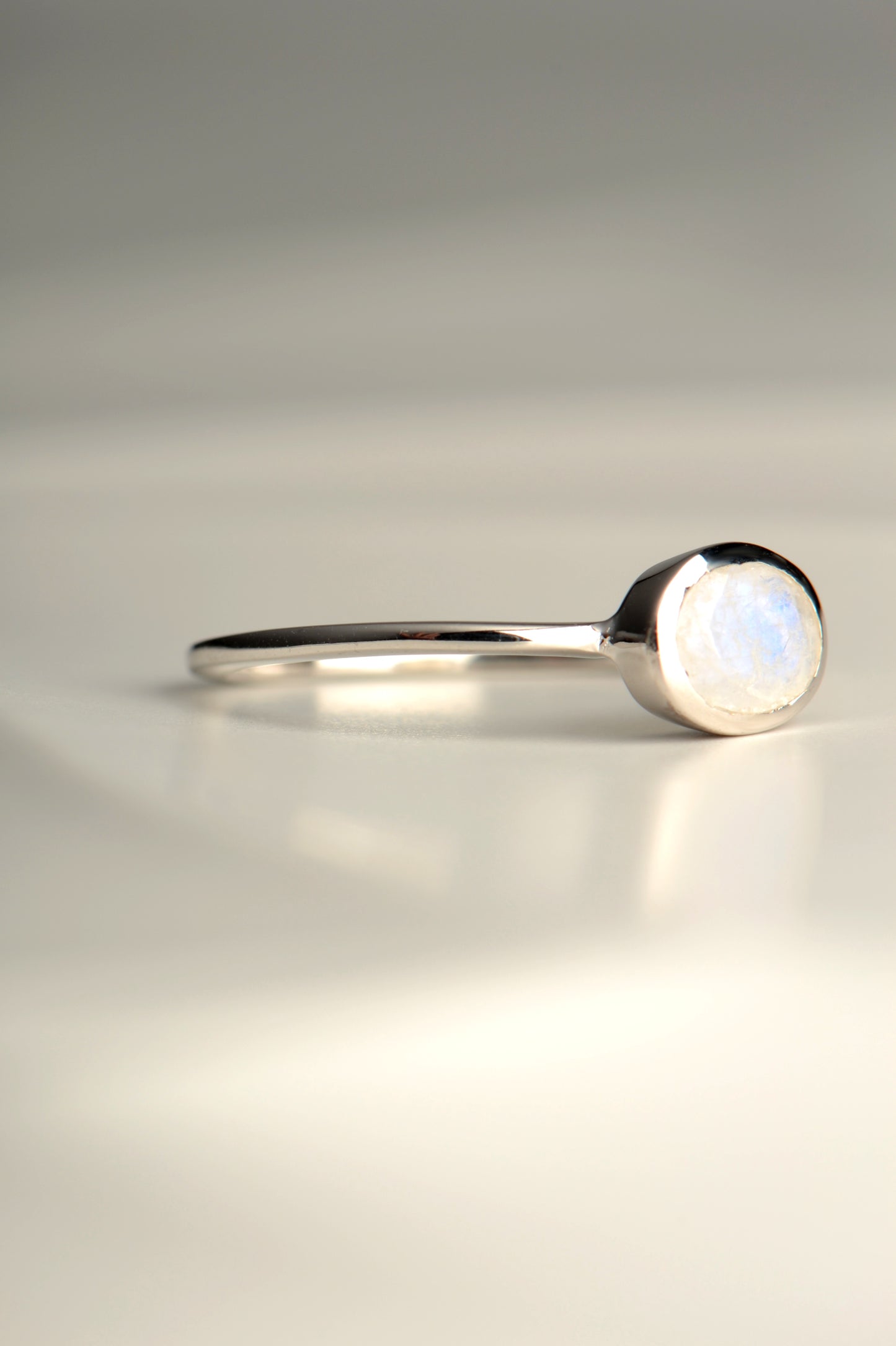 slim silver ring set with a rainbow moonstone from jewellery designer Jorge Revilla