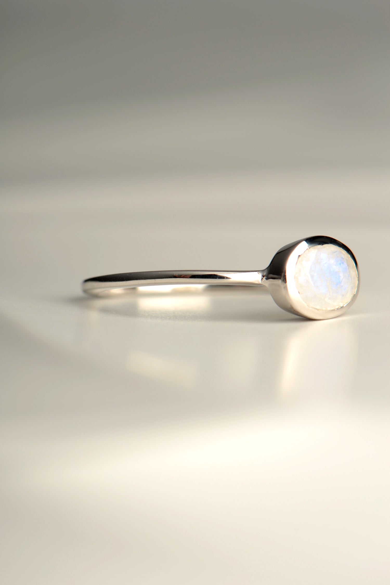 slim silver ring set with a rainbow moonstone from jewellery designer Jorge Revilla