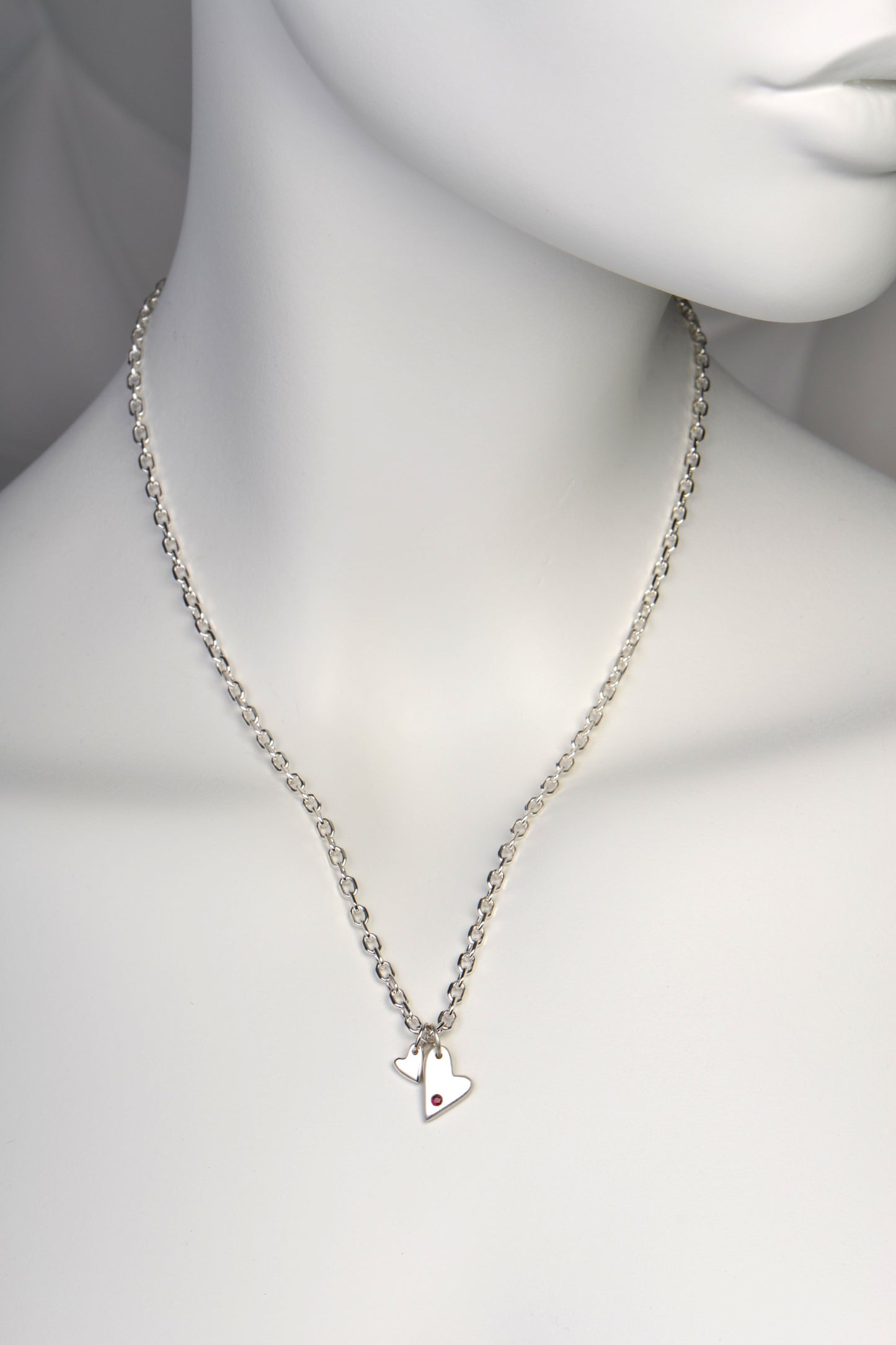 two heart necklace set with a ruby on an 18 inch, 45cm sterling silver angle filed chain