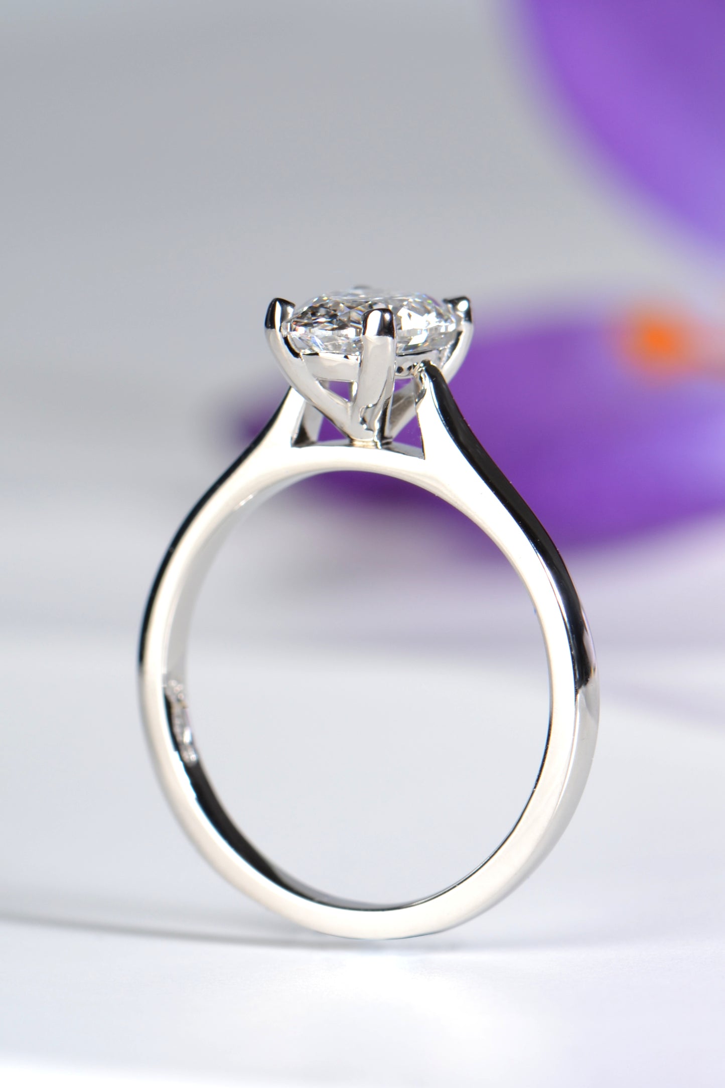 oval cut diamond platinum engagement ring that a wedding band will sit flat next to