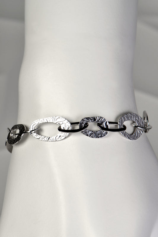 really special and different silver designer bracelet with large oval links that have a texture inspired by the natural beauty of frost patterns from Christine Sadler