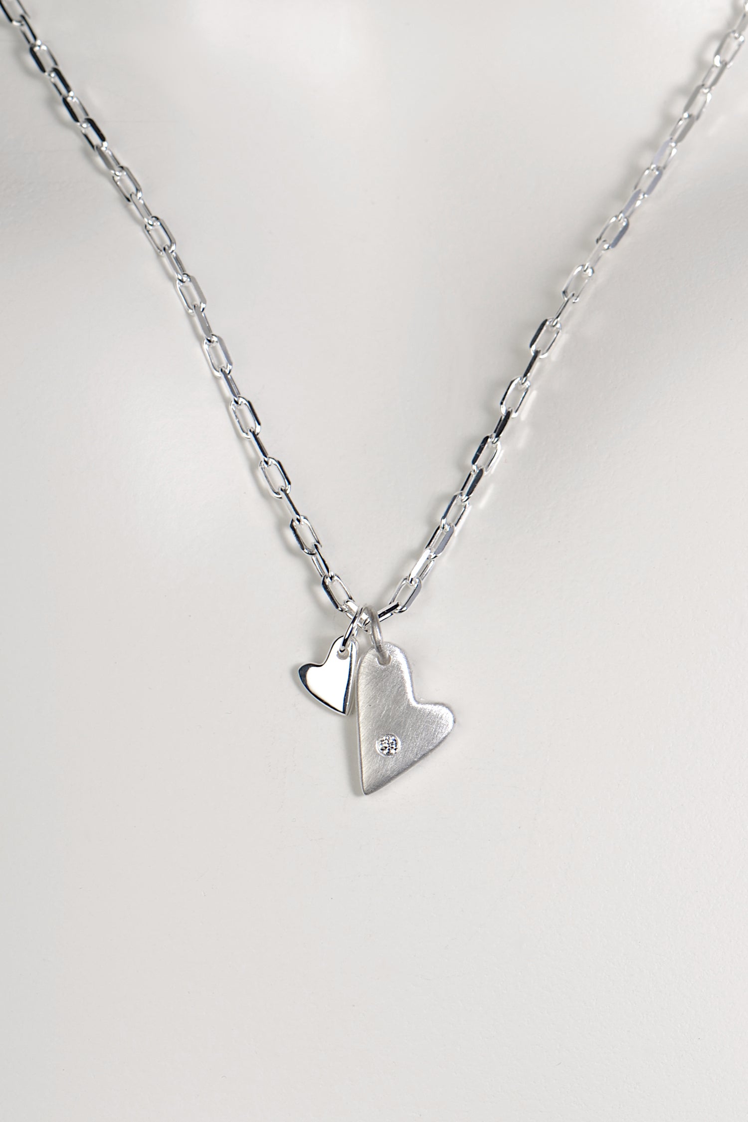 designer diamond silver necklace with two hearts in a modern brushed and polished finish - Christine Sadler