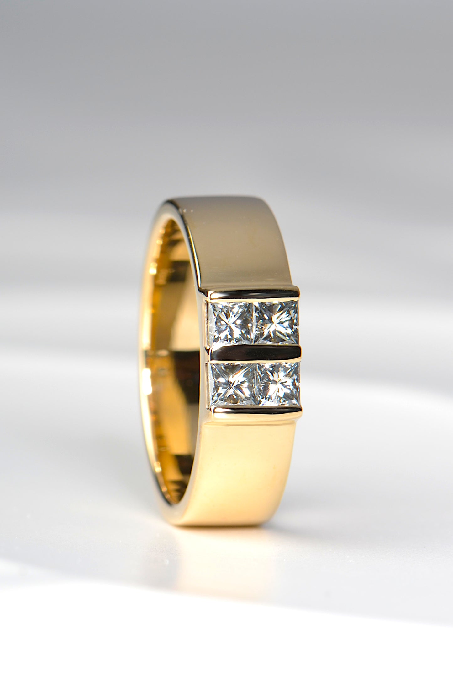 The perfect modern gold ring for a cake maker, inspired by Battenberg. Wide yellow gold ring with four gemstones set to form a larger square