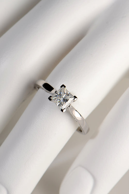 Lab grown moissanite platinum designer engagement ring with a princess cut stone and unusual setting